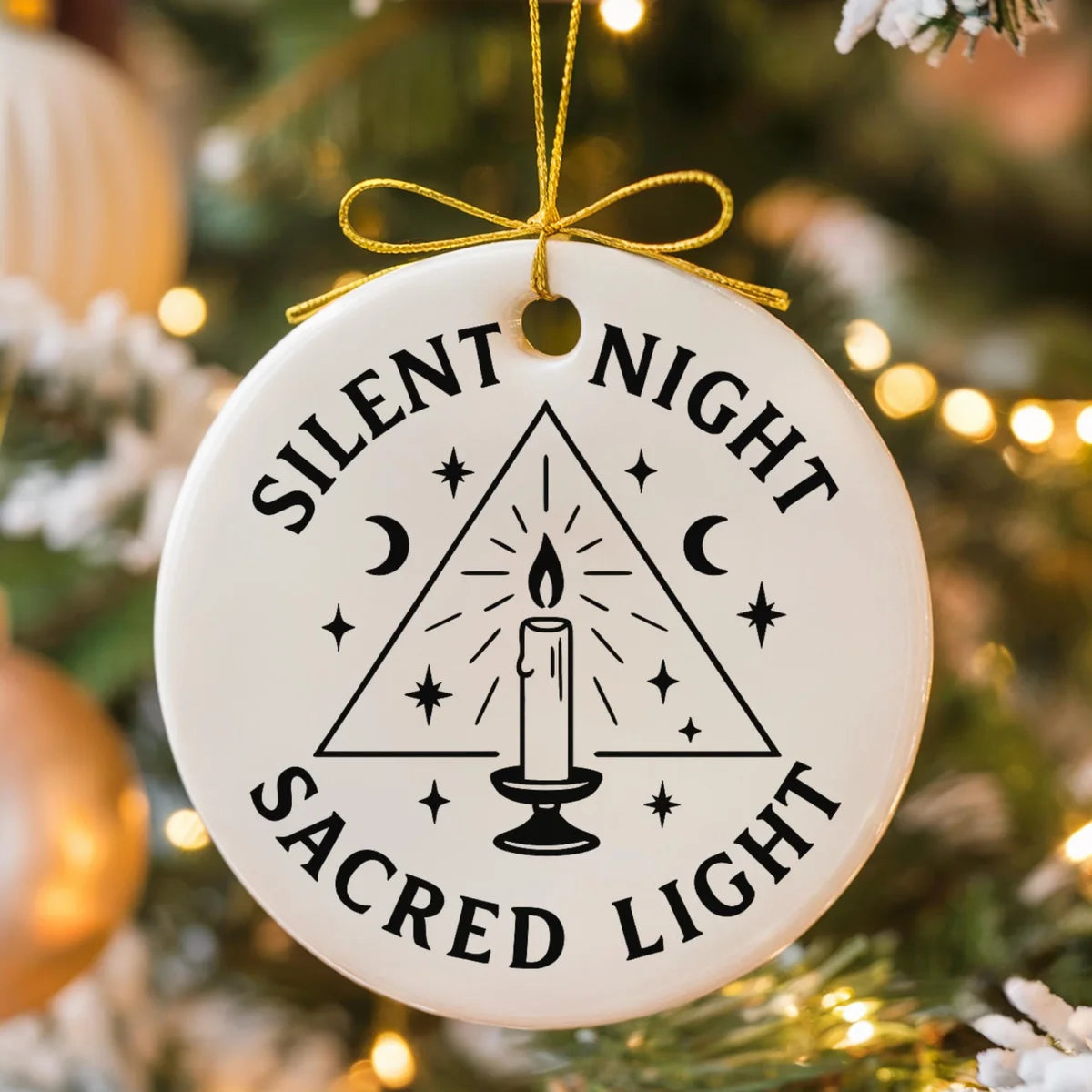 round ceramic ornament with the visible Silent Night Sacred Light message.