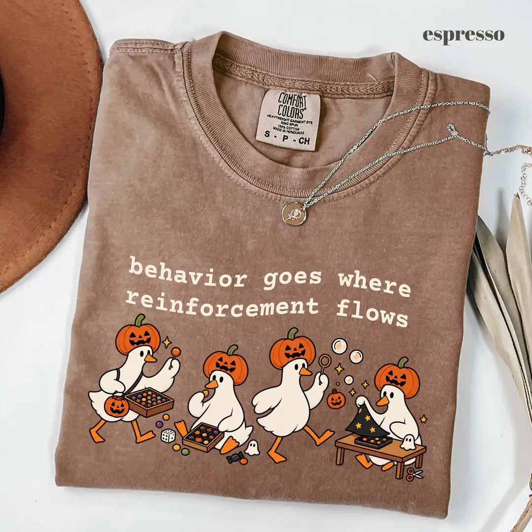Espresso Comfort Colors 1717 T-shirt with Behavior Goes Where Reinforcement Flows design worn by a model