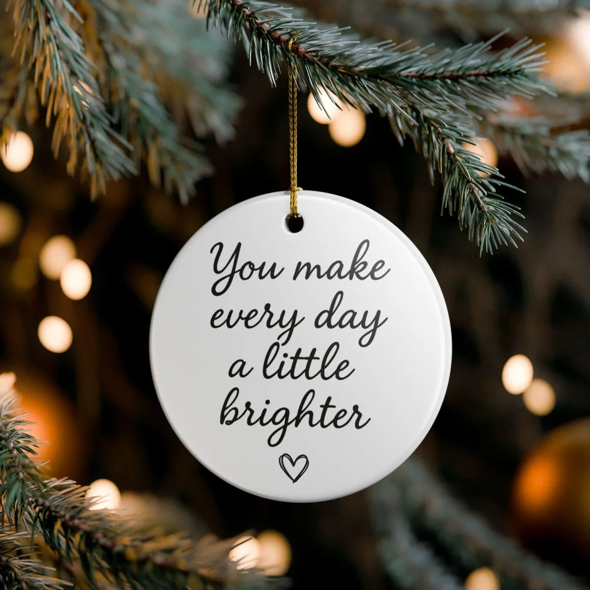 Alternate view of a round ceramic ornament with the visible You Make a Difference Just by Being You message.
