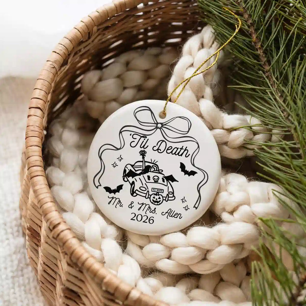 Personalized ceramic ornament featuring Til Death shown in a basket lifestyle scene.