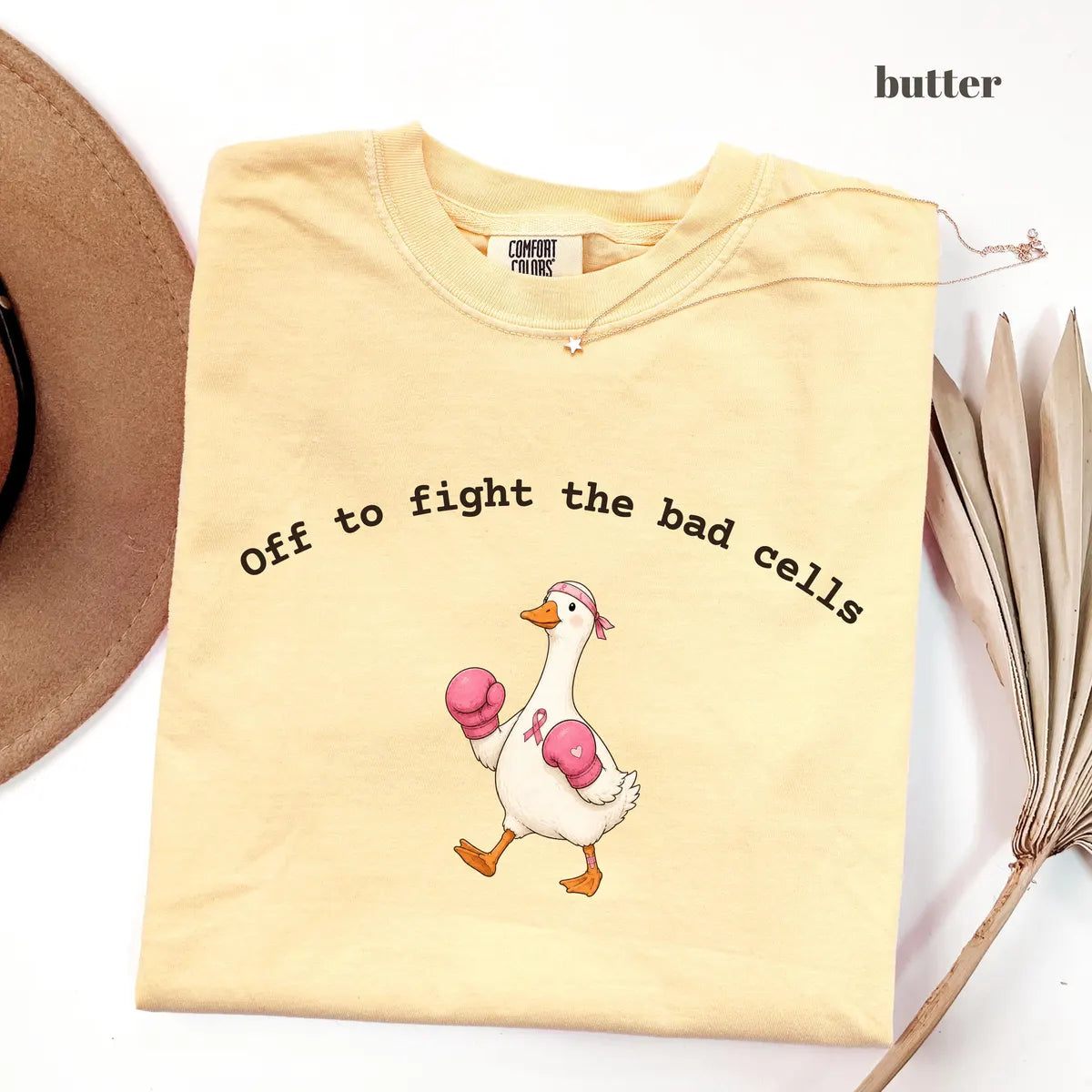 Butter Comfort Colors 1717 T-shirt with Off To Fight The Bad Cells Goose design worn by a model
