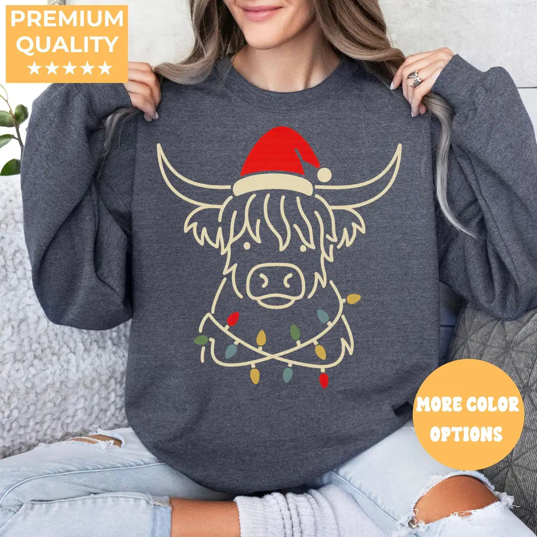 MILITARY GREEN Crewneck sweatshirt with printed Highland Cow Christmas design shown on a model.