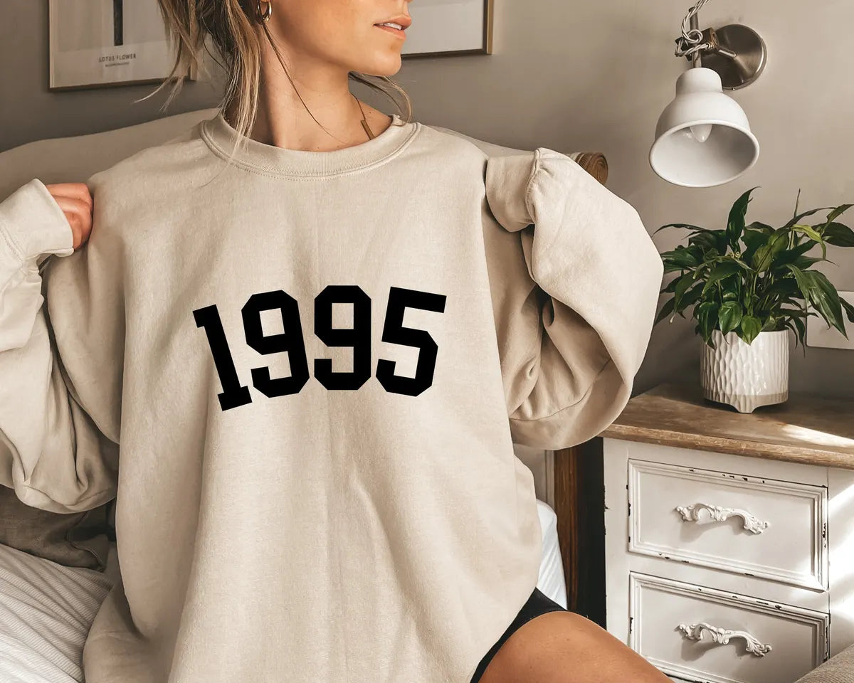Crewneck sweatshirt product details card showing construction and care information.