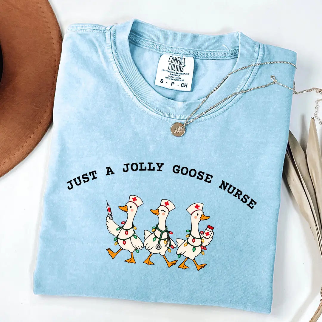 Comfort Colors 1717 T-shirt with Jolly Goose Christmas Nurse design worn by a model