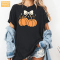 Coquette Bow Pumpkins - Women's Halloween Comfort Colors T-Shirt alternate product view in Black.