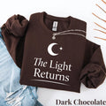Crewneck sweatshirt with The Light Returns design, alternate product view.