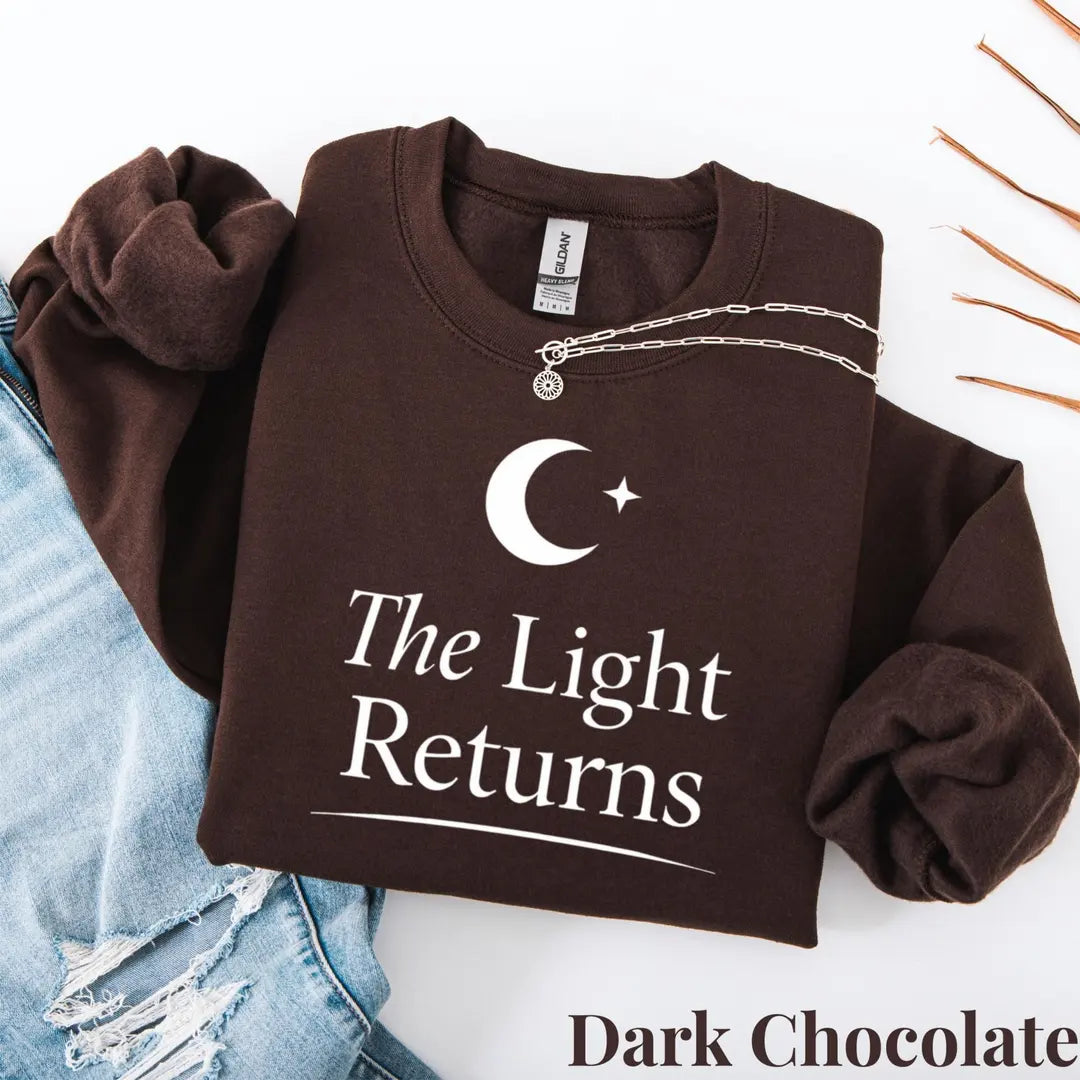 Crewneck sweatshirt with The Light Returns design, alternate product view.