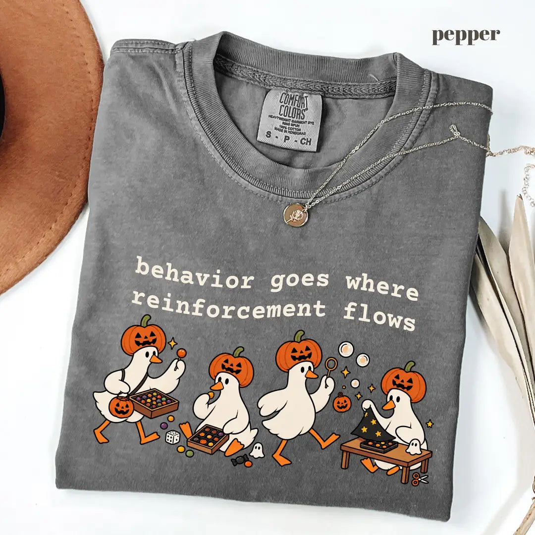 Pepper Comfort Colors 1717 T-shirt with Behavior Goes Where Reinforcement Flows design worn by a model