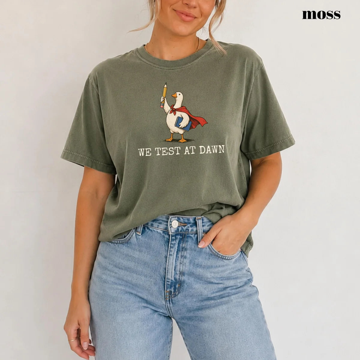 Moss Comfort Colors 1717 T-shirt with We Test at Dawn Teacher design worn by a model