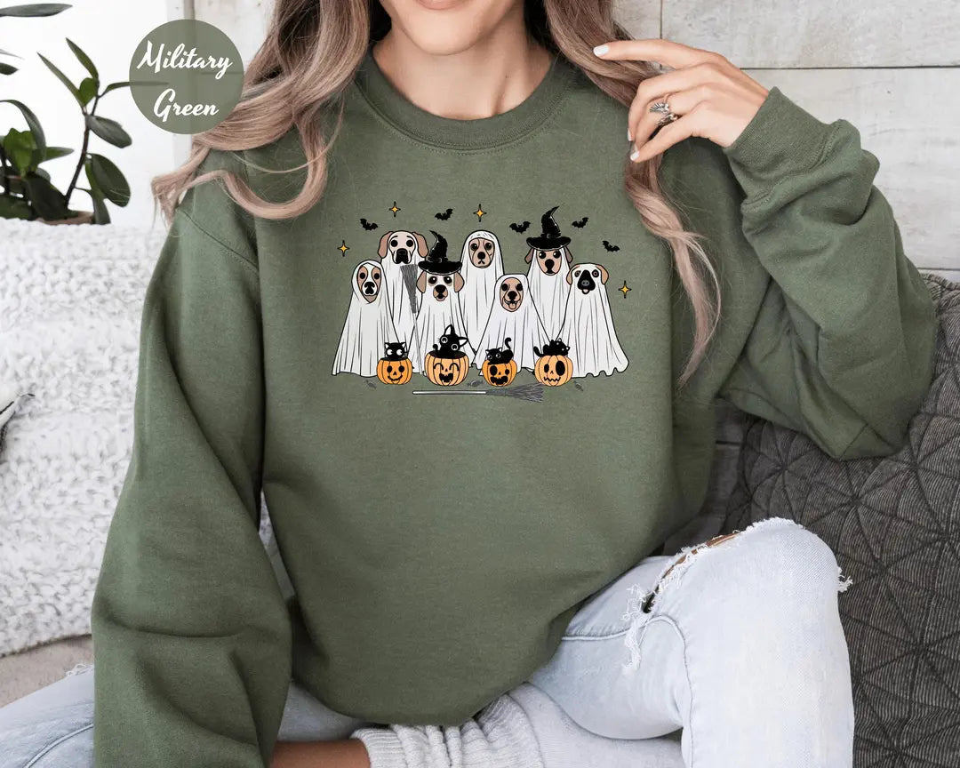 Military Green crewneck sweatshirt with printed ghost dogs with witch hats, pumpkins and bats, worn by a model.