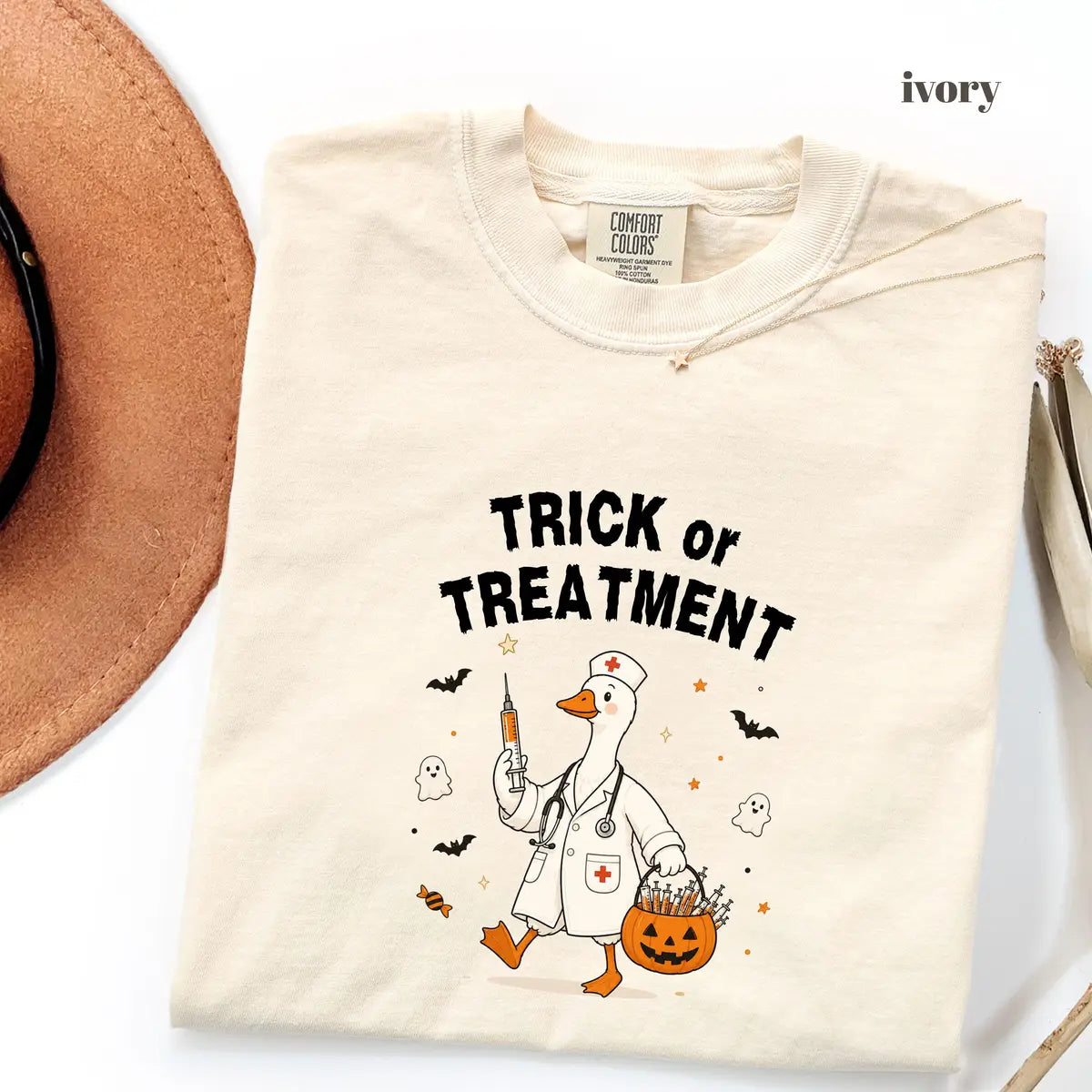 Ivory Comfort Colors 1717 T-shirt with Trick or Treatment Nurse Goose design worn by a model