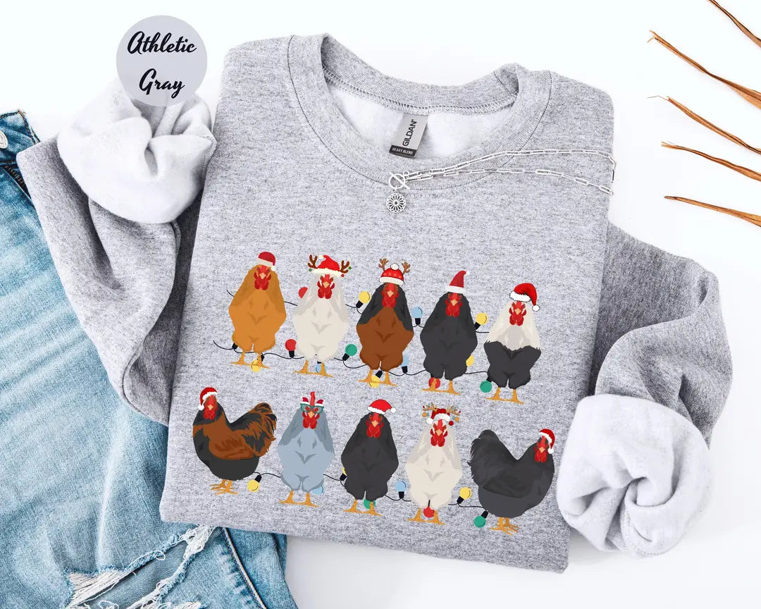 Athletic Gray crewneck sweatshirt with two rows of colorful chickens wearing Santa hats, flat lay view.
