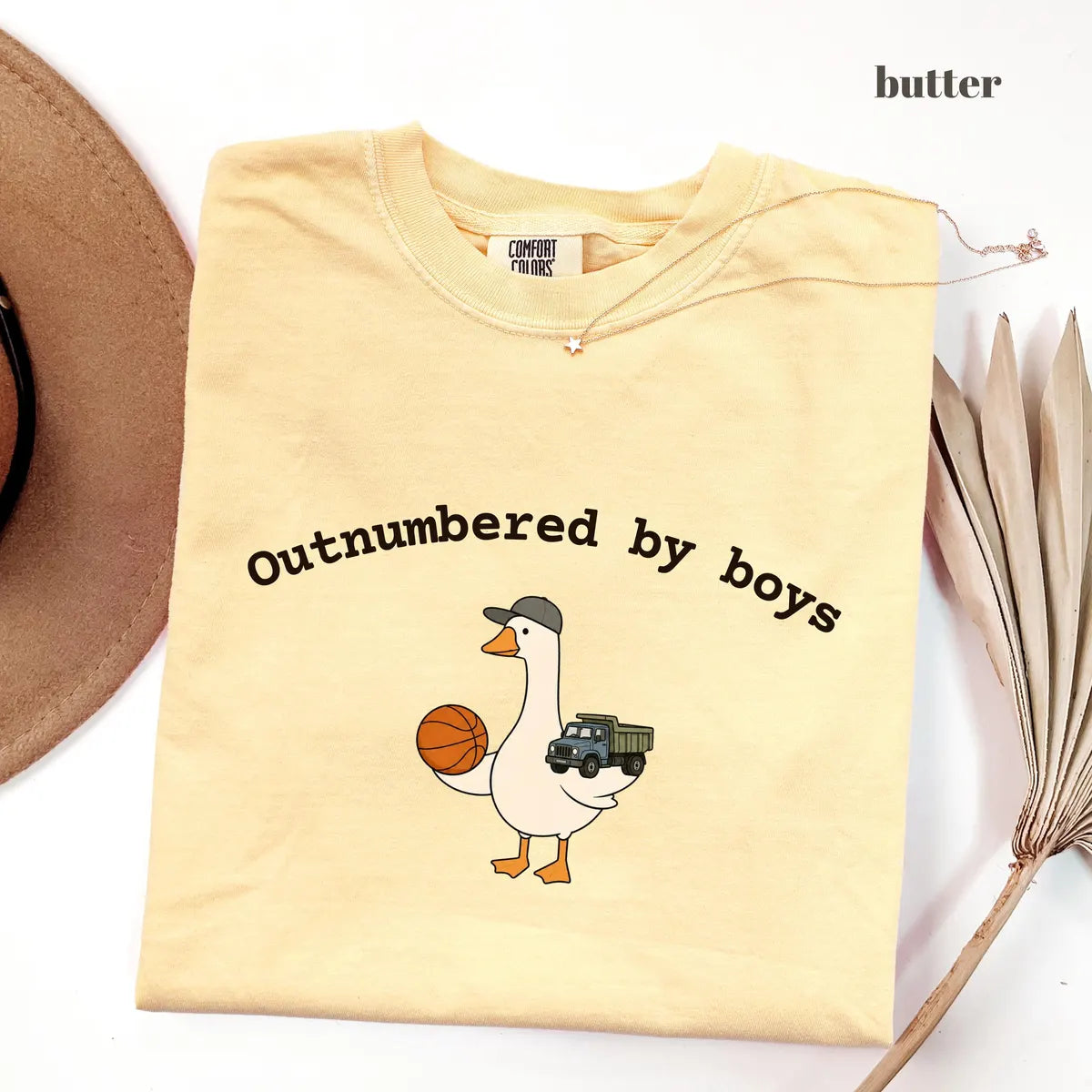 Butter Comfort Colors 1717 T-shirt with Outnumbered By Boys design worn by a model