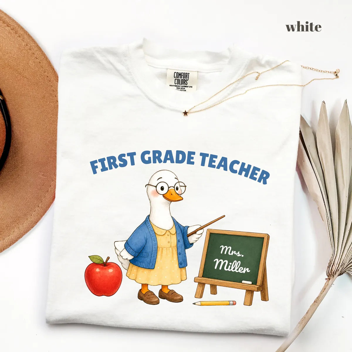White Comfort Colors 1717 T-shirt with First Grade Teacher design worn by a model