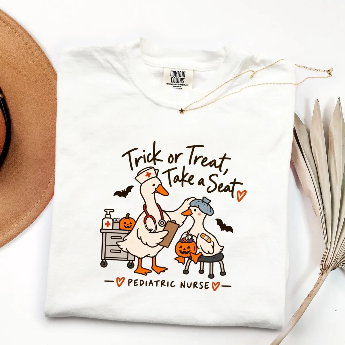 White Comfort Colors 1717 T-shirt with Pediatric Nurse Halloween design
