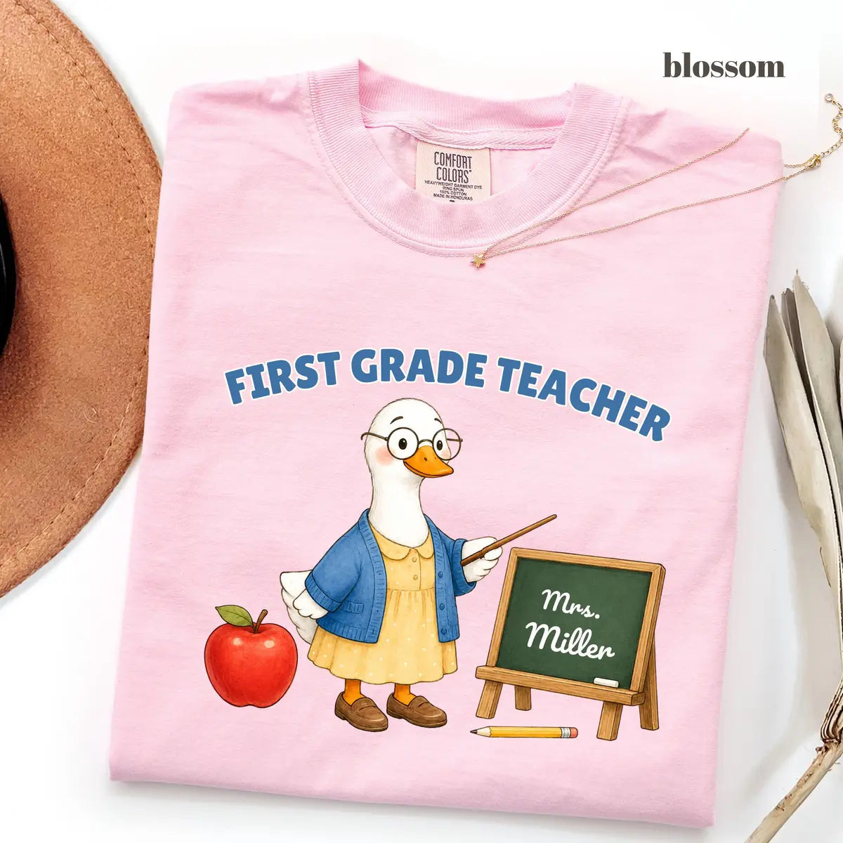 Blossom Comfort Colors 1717 T-shirt with First Grade Teacher design worn by a model