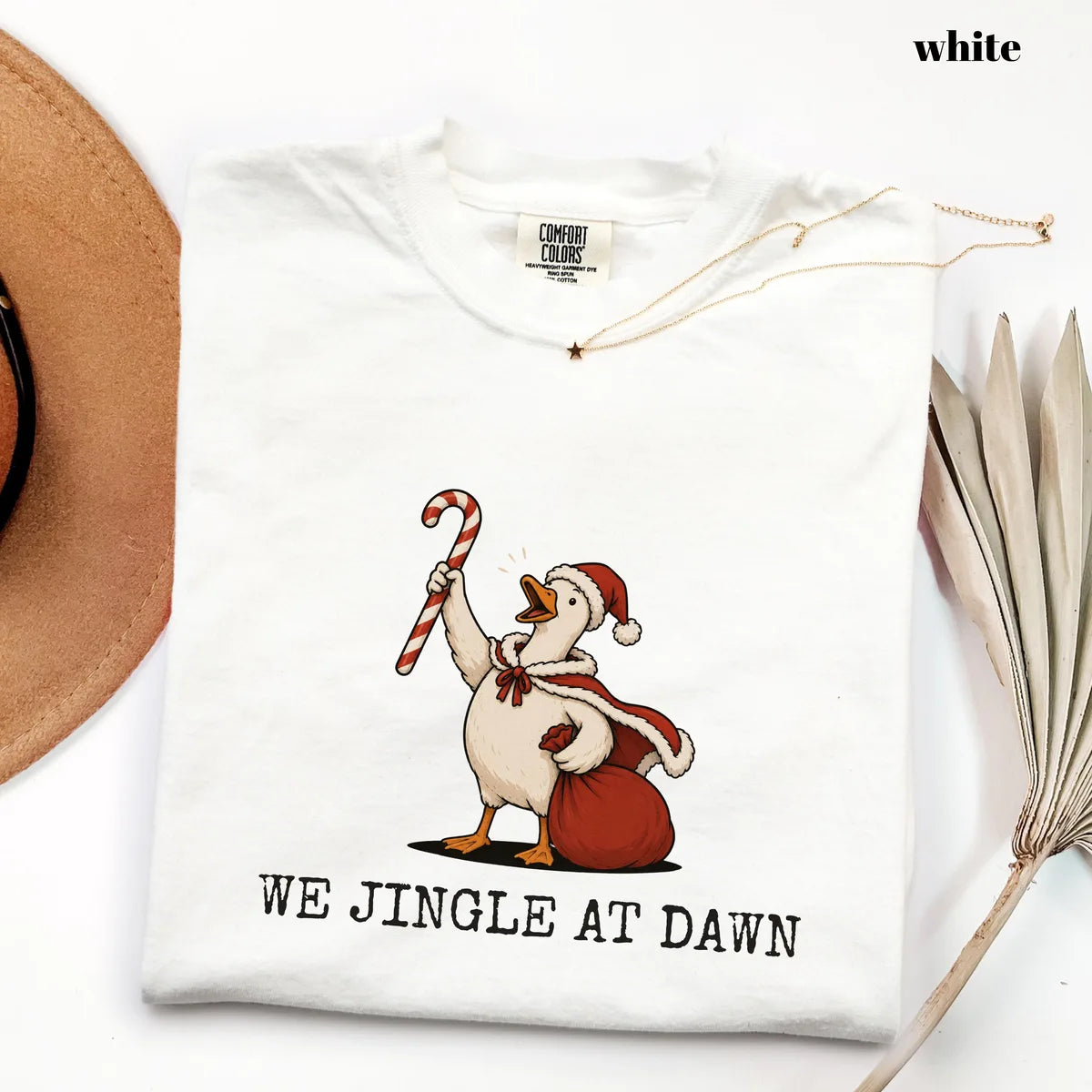 White Comfort Colors 1717 T-shirt with We Jingle at Dawn Christmas design worn by a model