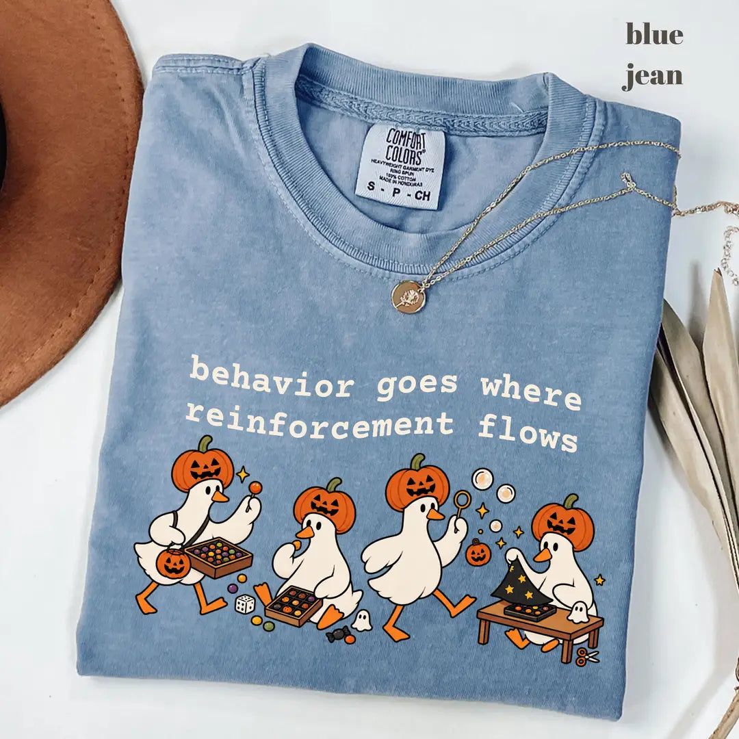 Blue Jean Comfort Colors 1717 T-shirt with Behavior Goes Where Reinforcement Flows design worn by a model