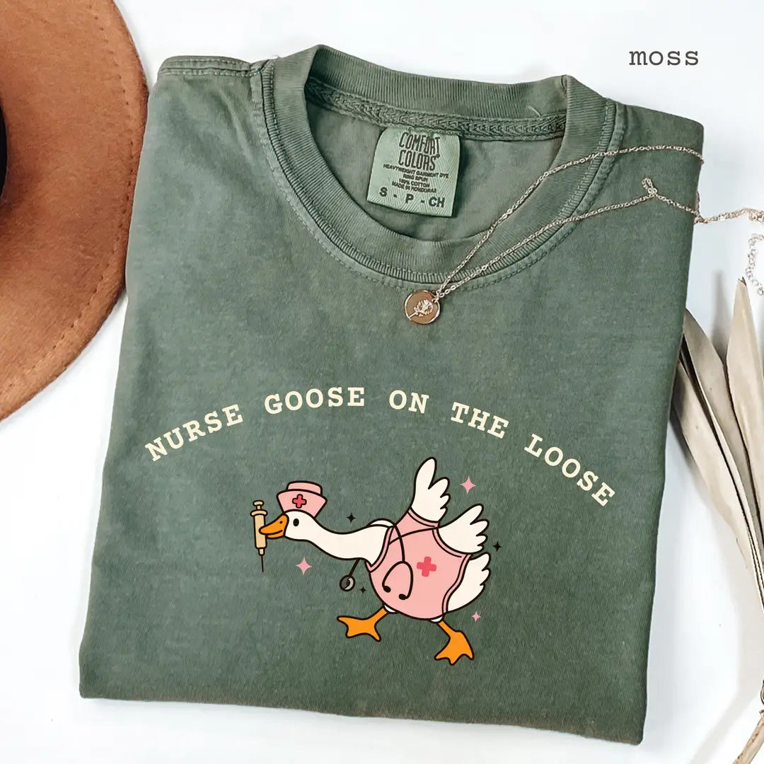 Moss Comfort Colors 1717 T-shirt with Nurse Goose on the Loose design worn by a model
