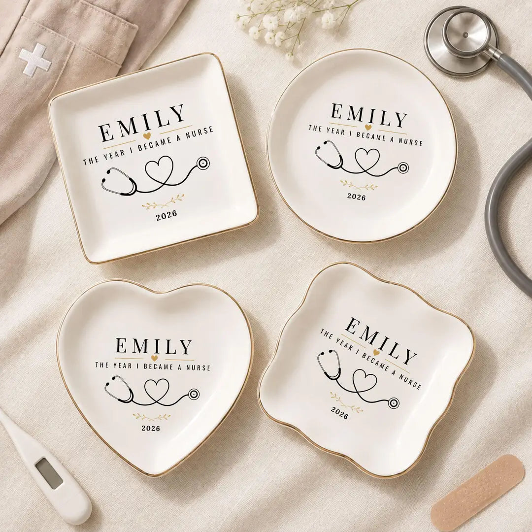 Four ceramic nurse ring dishes in different shapes with a name and year, styled with a stethoscope, thermometer and bandage