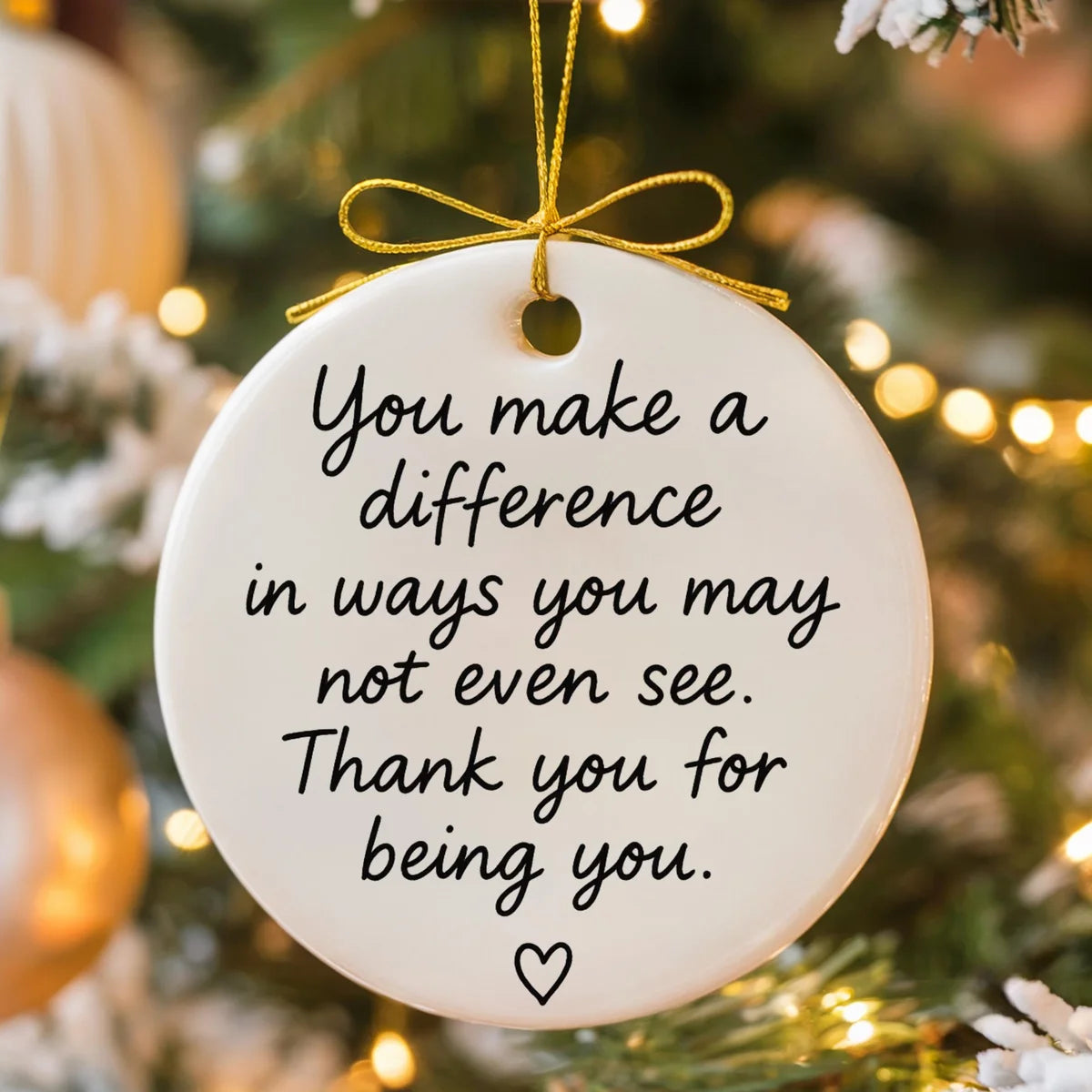 round ceramic ornament with the visible You Make a Difference message.