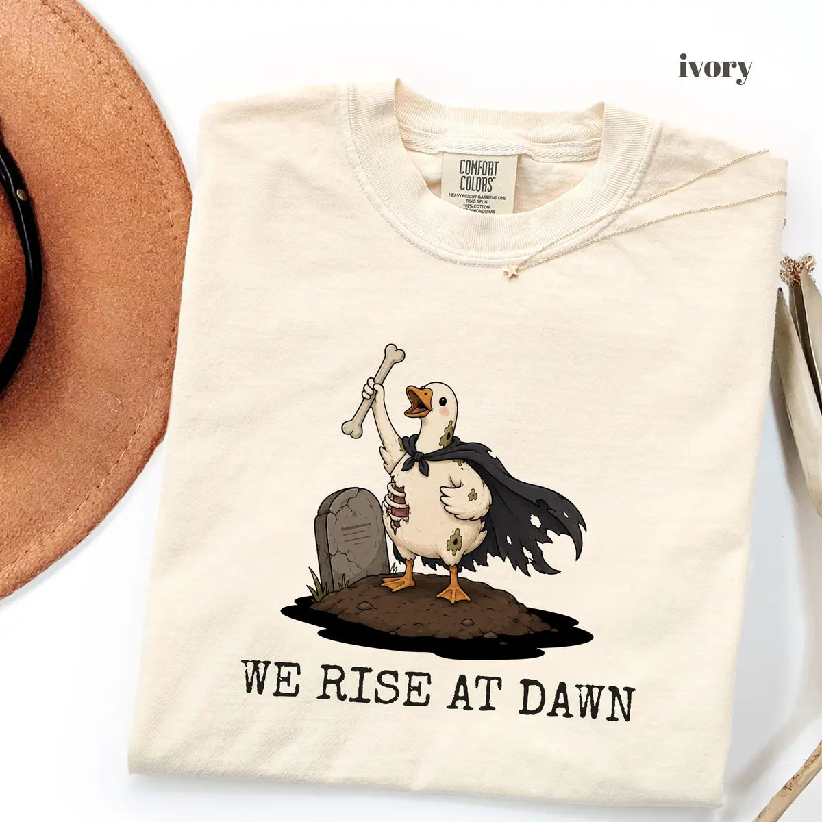 Ivory Comfort Colors 1717 T-shirt with We Rise at Dawn Halloween design worn by a model