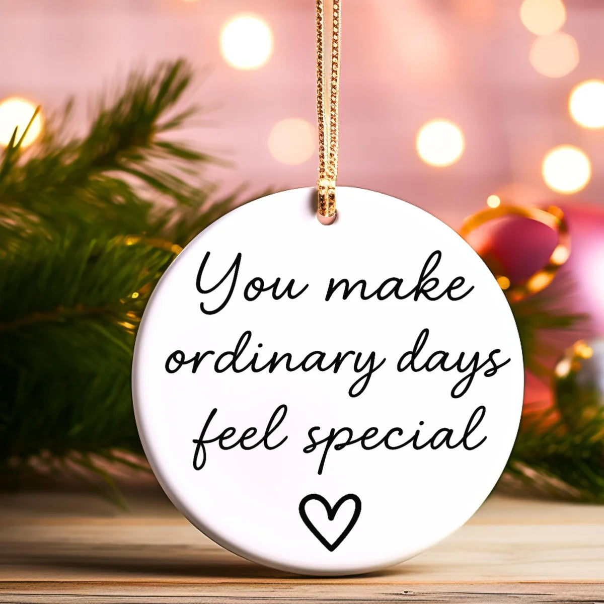 Alternate view of a round ceramic ornament with the visible You Make Ordinary Days Feel Special message.