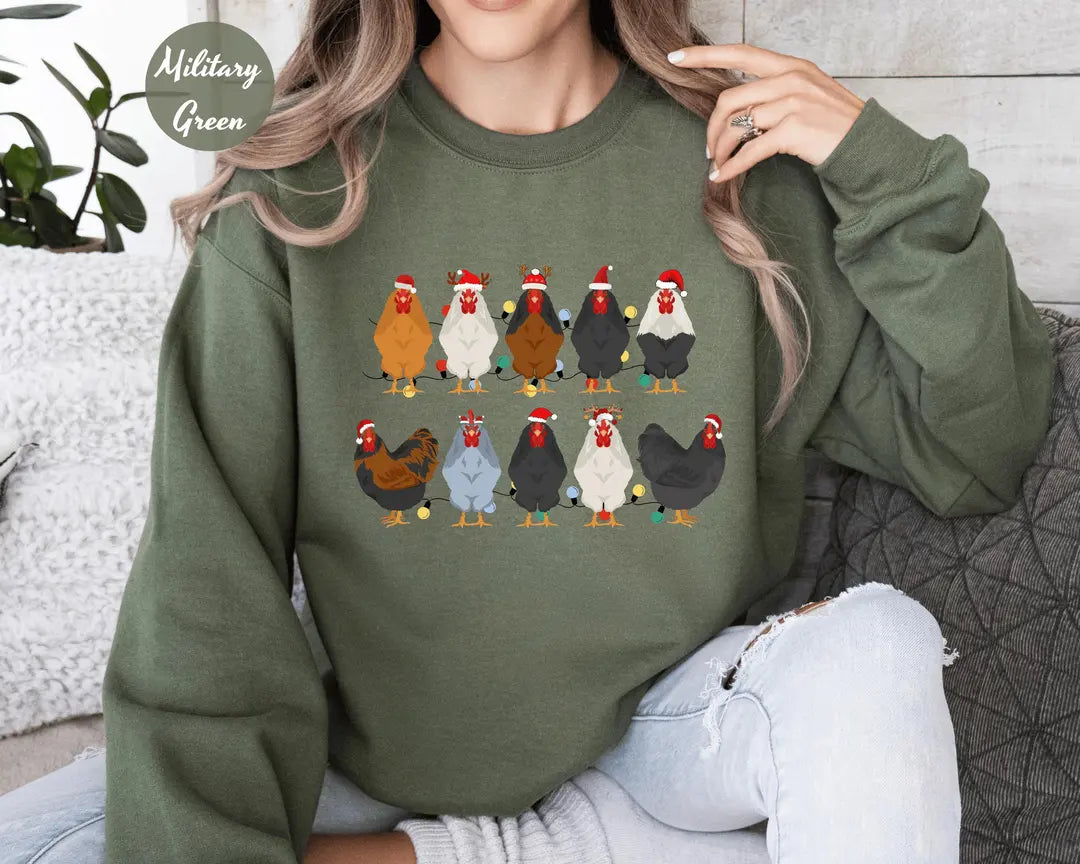 Military Green crewneck sweatshirt with two rows of colorful chickens wearing Santa hats, worn by a model.