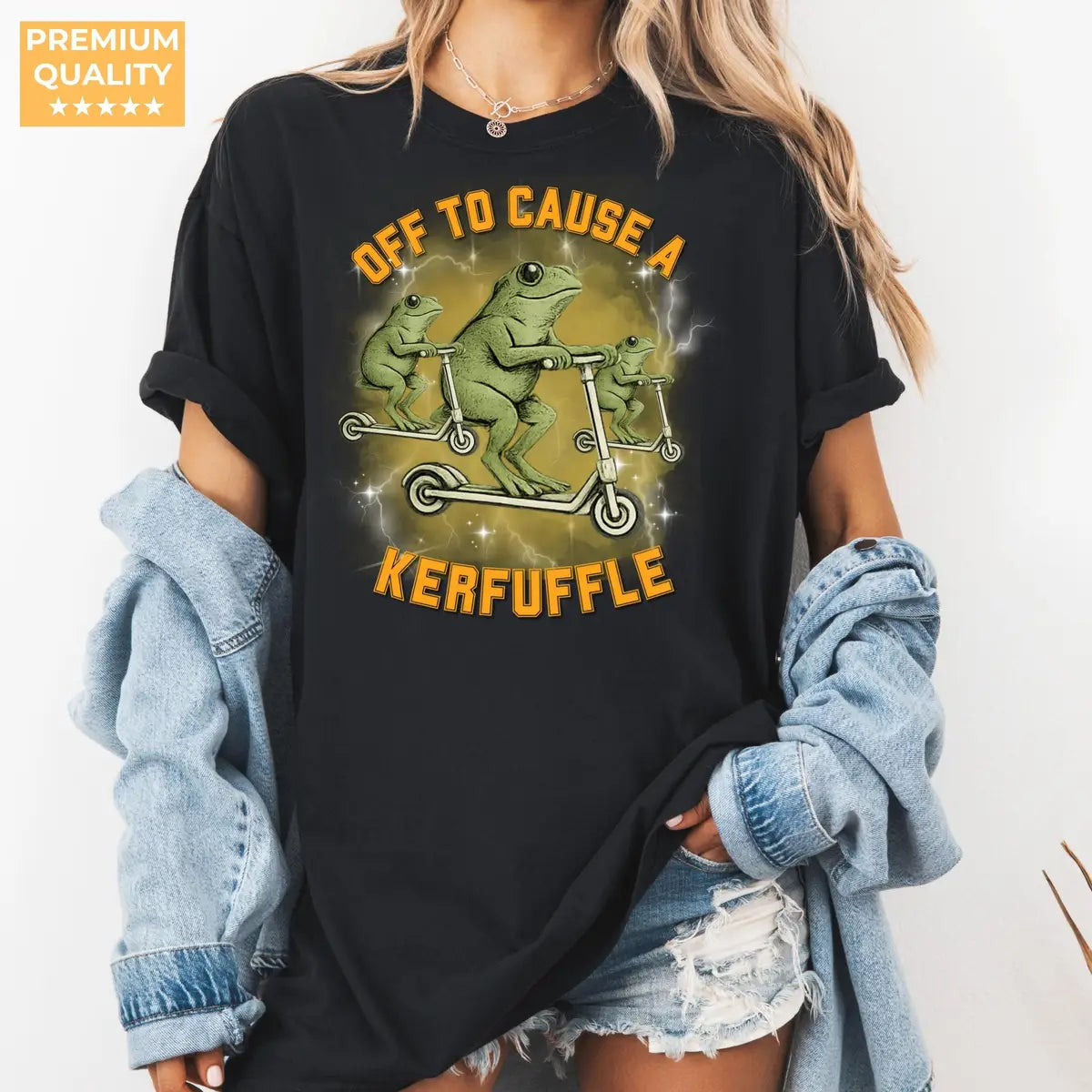 Black Comfort Colors 1717 T-shirt with Off To Cause A Kerfuffle Funny Frog Scooter Silly Animal Mental Health Adult Humor Sarcastic design, alternate product view.