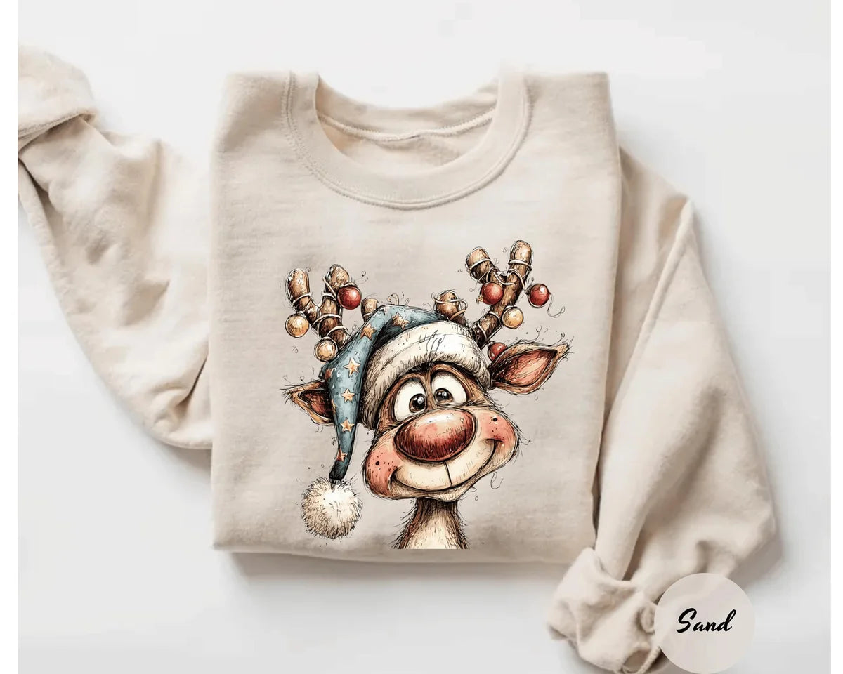 Sand crewneck sweatshirt with a retro reindeer wearing a knit hat with ornament antlers, flat lay view.
