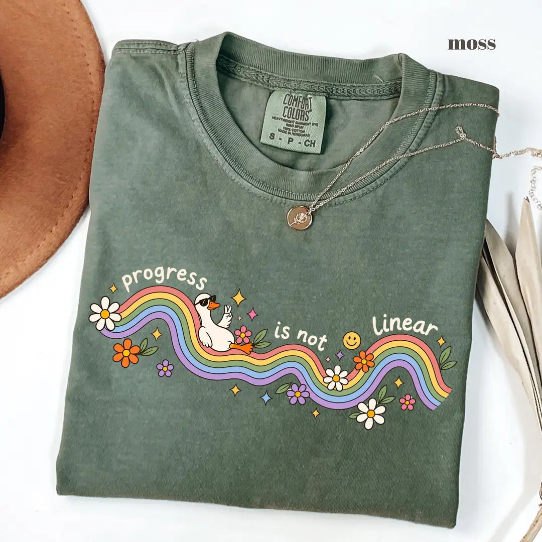 Moss Comfort Colors 1717 T-shirt with Progress Is Not Linear design worn by a model