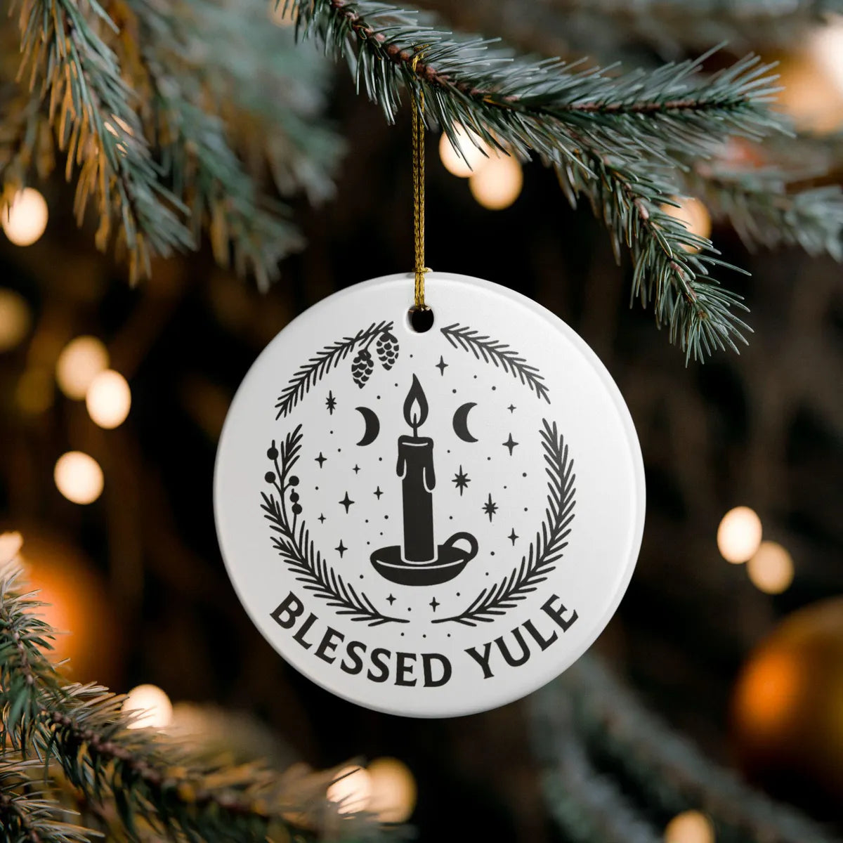 Alternate view of a round ceramic ornament with the visible Blessed Yule message.