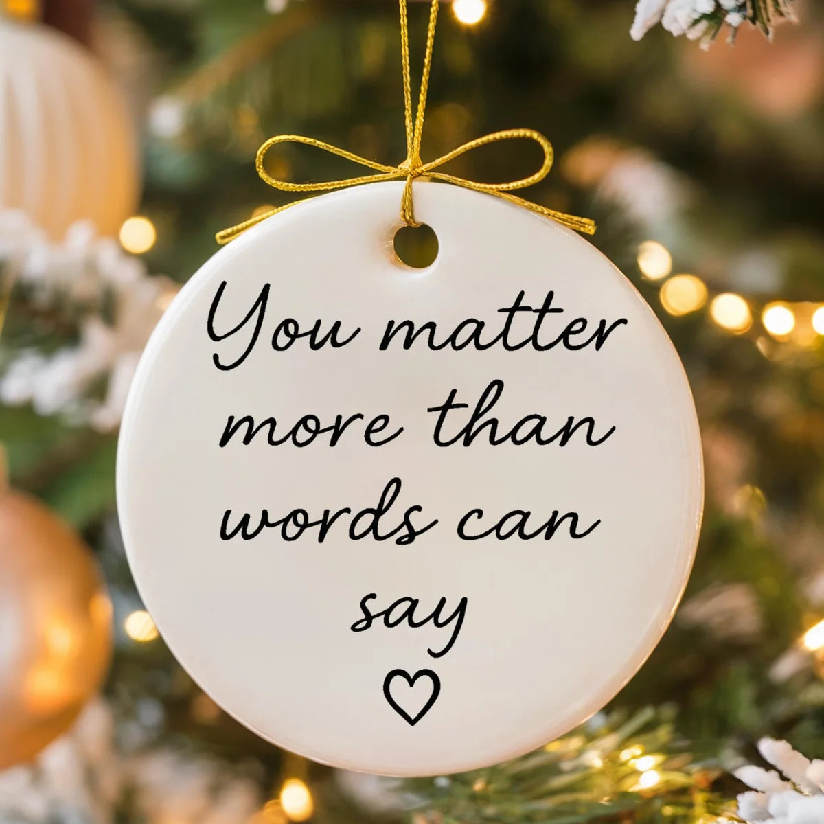 Alternate view of a round ceramic ornament with the visible You Matter More Than Words Can Say message.