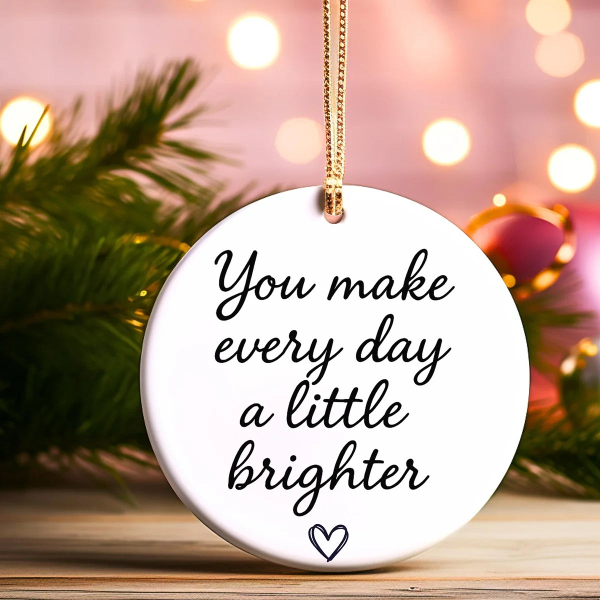 Alternate view of a round ceramic ornament with the visible You Make a Difference Just by Being You message.