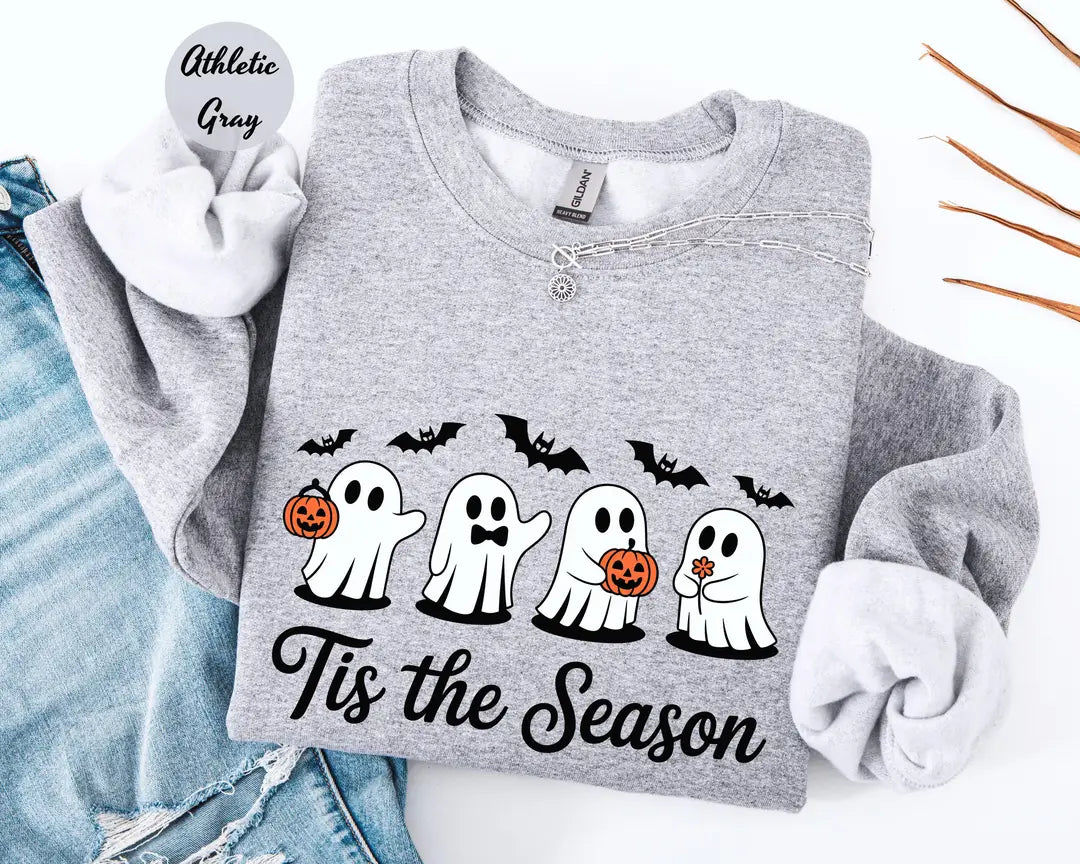 Athletic Gray crewneck sweatshirt with printed four cute ghosts with pumpkins and bats above the words tis the season, flat lay view.