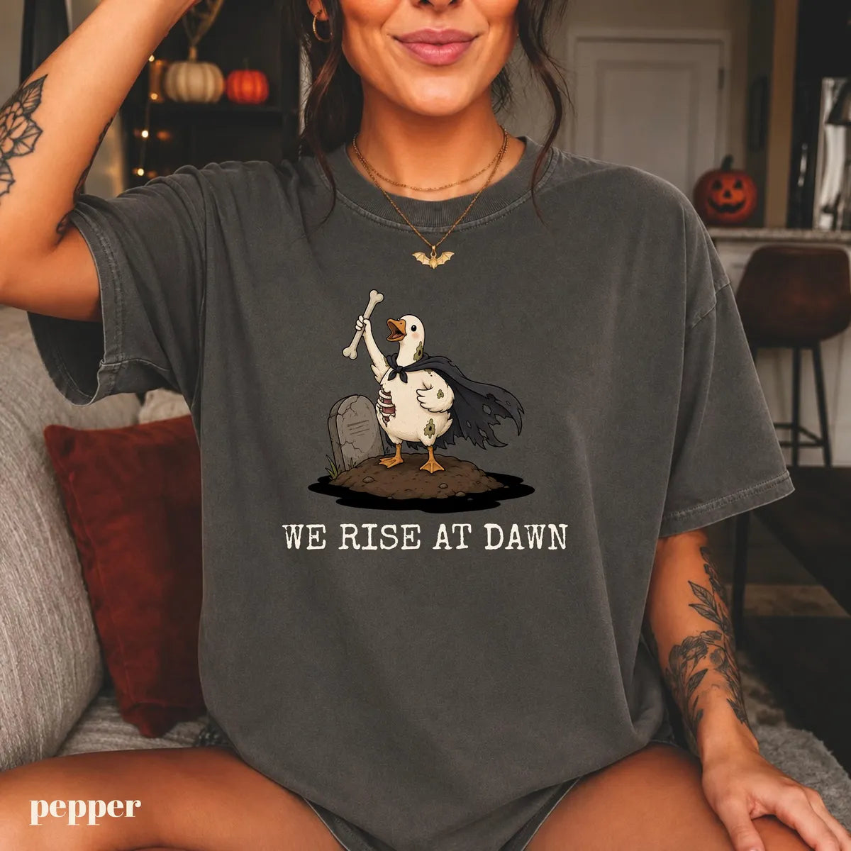 Pepper Comfort Colors 1717 T-shirt with We Rise at Dawn Halloween design worn by a model