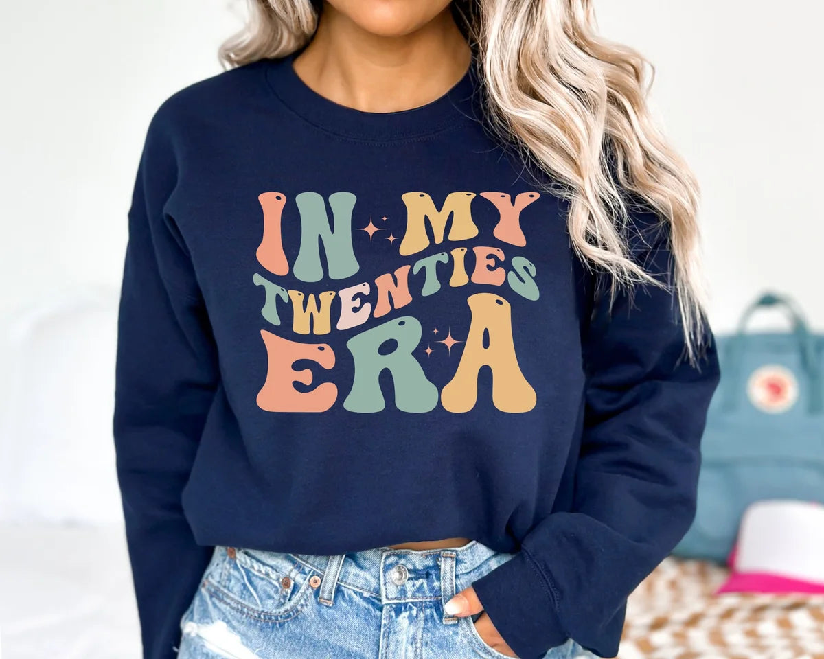 Crewneck sweatshirt with In My Twenties Era design, hero view.