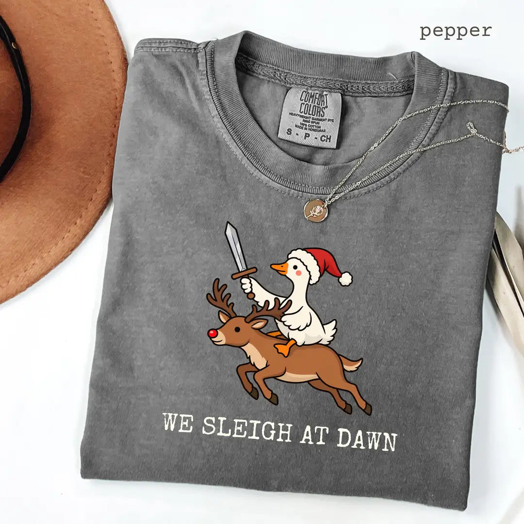 Pepper Comfort Colors 1717 T-shirt with We Sleigh at Dawn Goose design worn by a model