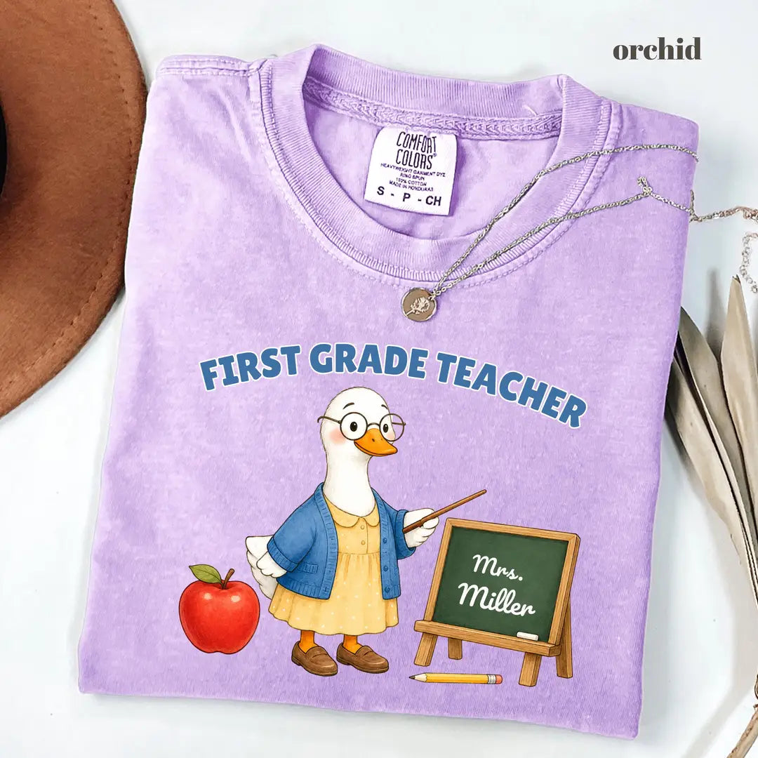 Comfort Colors 1717 T-shirt with First Grade Teacher design worn by a model view 2
