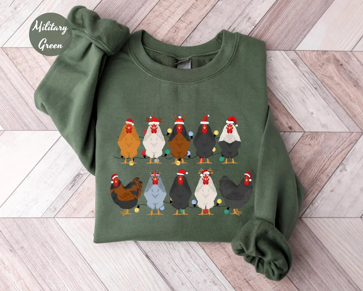 Military Green crewneck sweatshirt with two rows of colorful chickens wearing Santa hats, flat lay view.
