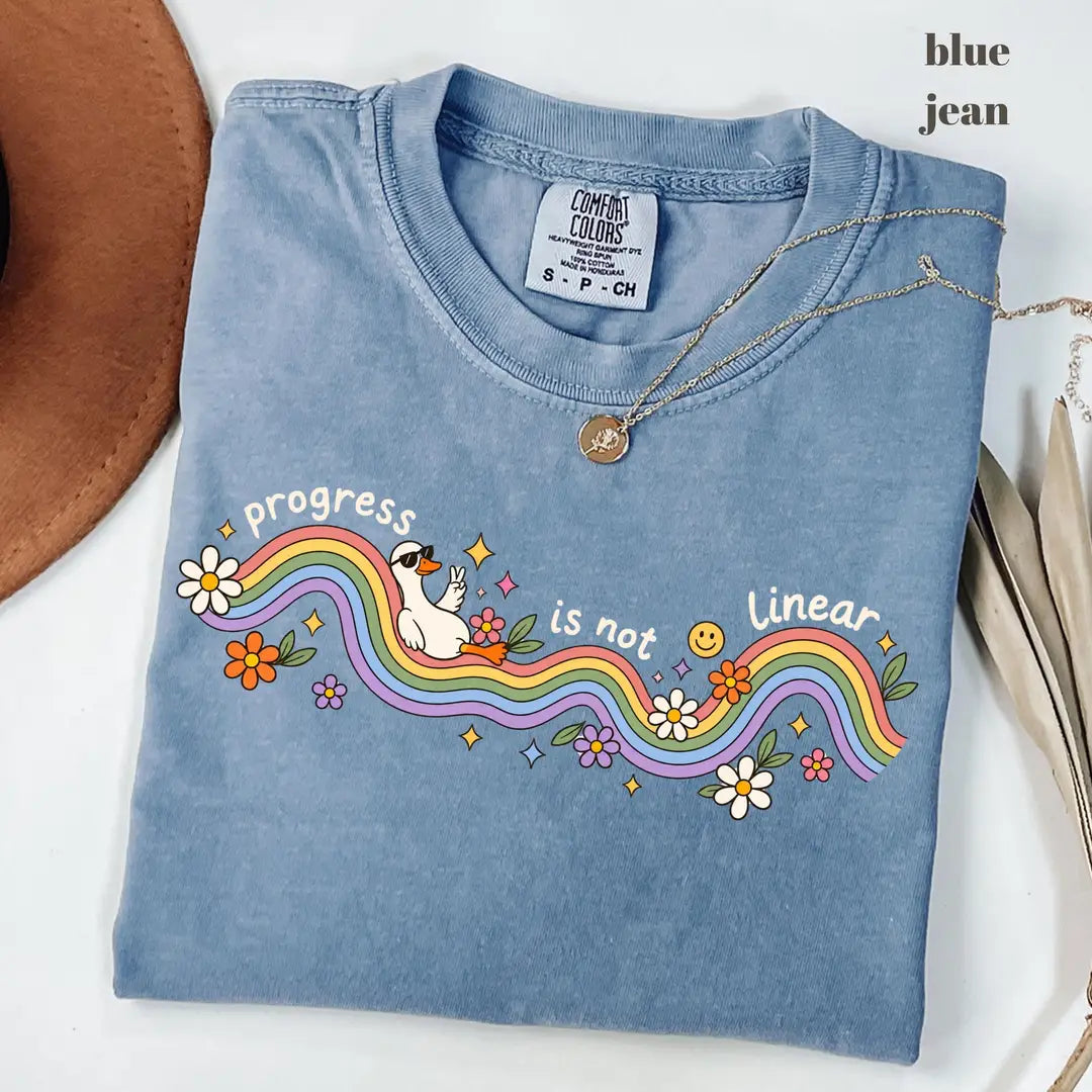 Blue Jean Comfort Colors 1717 T-shirt with Progress Is Not Linear design worn by a model