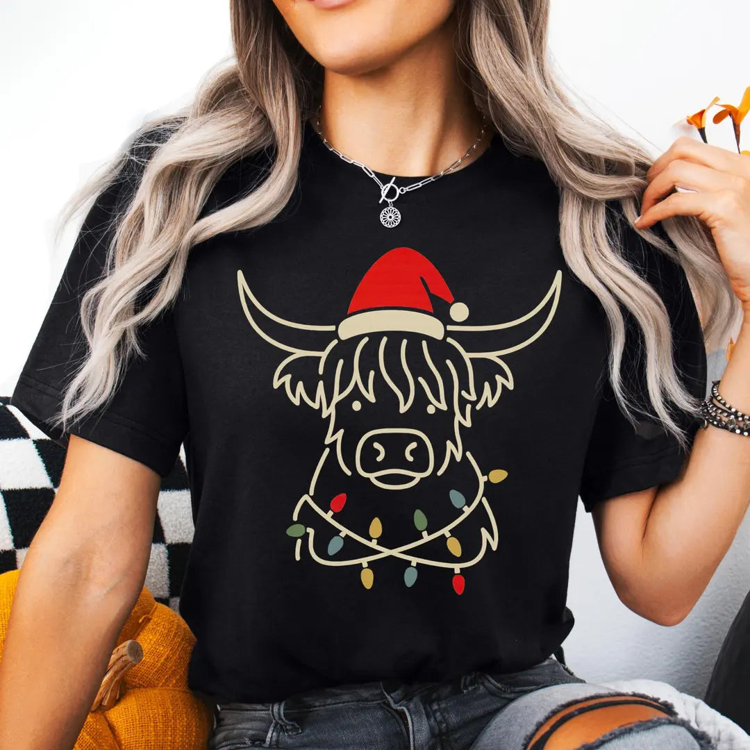 BLACK Crewneck sweatshirt with printed Highland Cow Christmas design shown on a model.