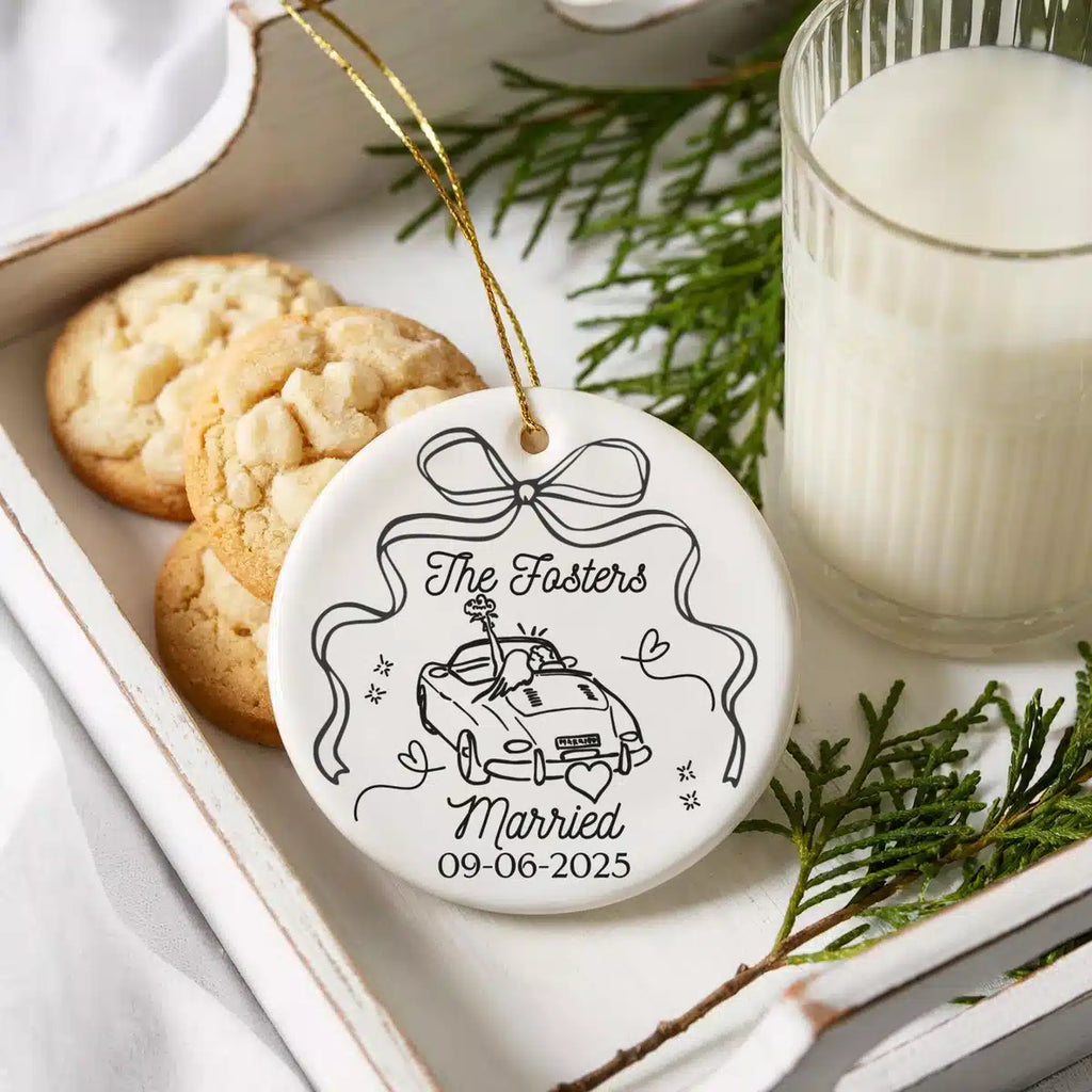 Personalized ceramic ornament featuring First Christmas Married shown in a cookies-and-milk lifestyle scene.