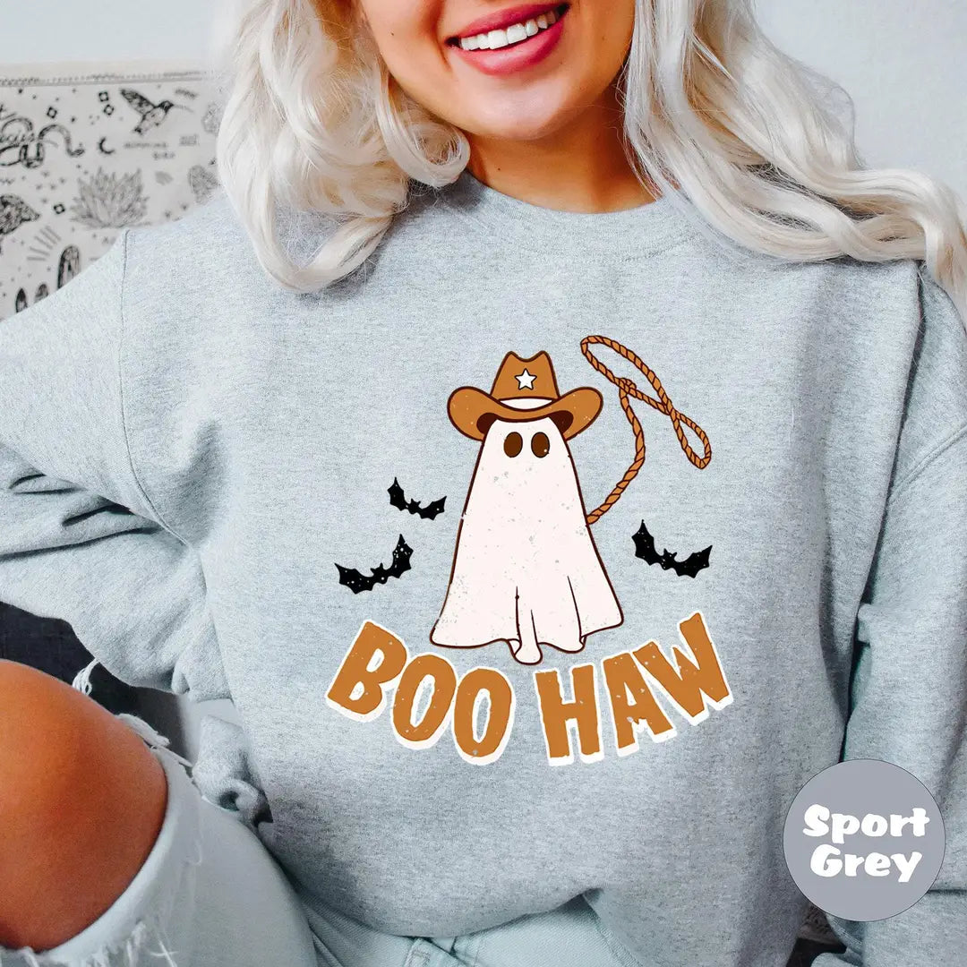 Sport Grey crewneck sweatshirt with a cowboy ghost with a lasso and bats above the words boo haw, worn by a model.