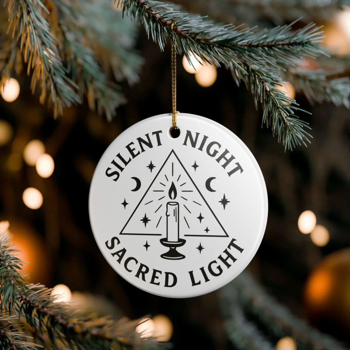 Alternate view of a round ceramic ornament with the visible Silent Night Sacred Light message.