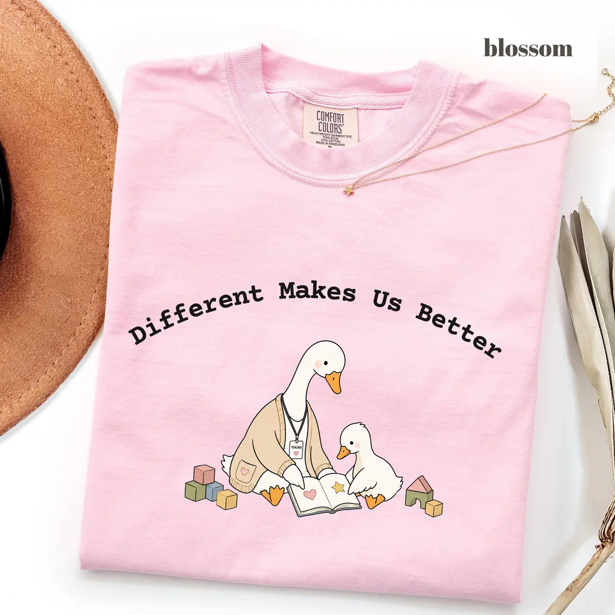 Blossom Comfort Colors 1717 T-shirt with Different Makes Us Better design worn by a model