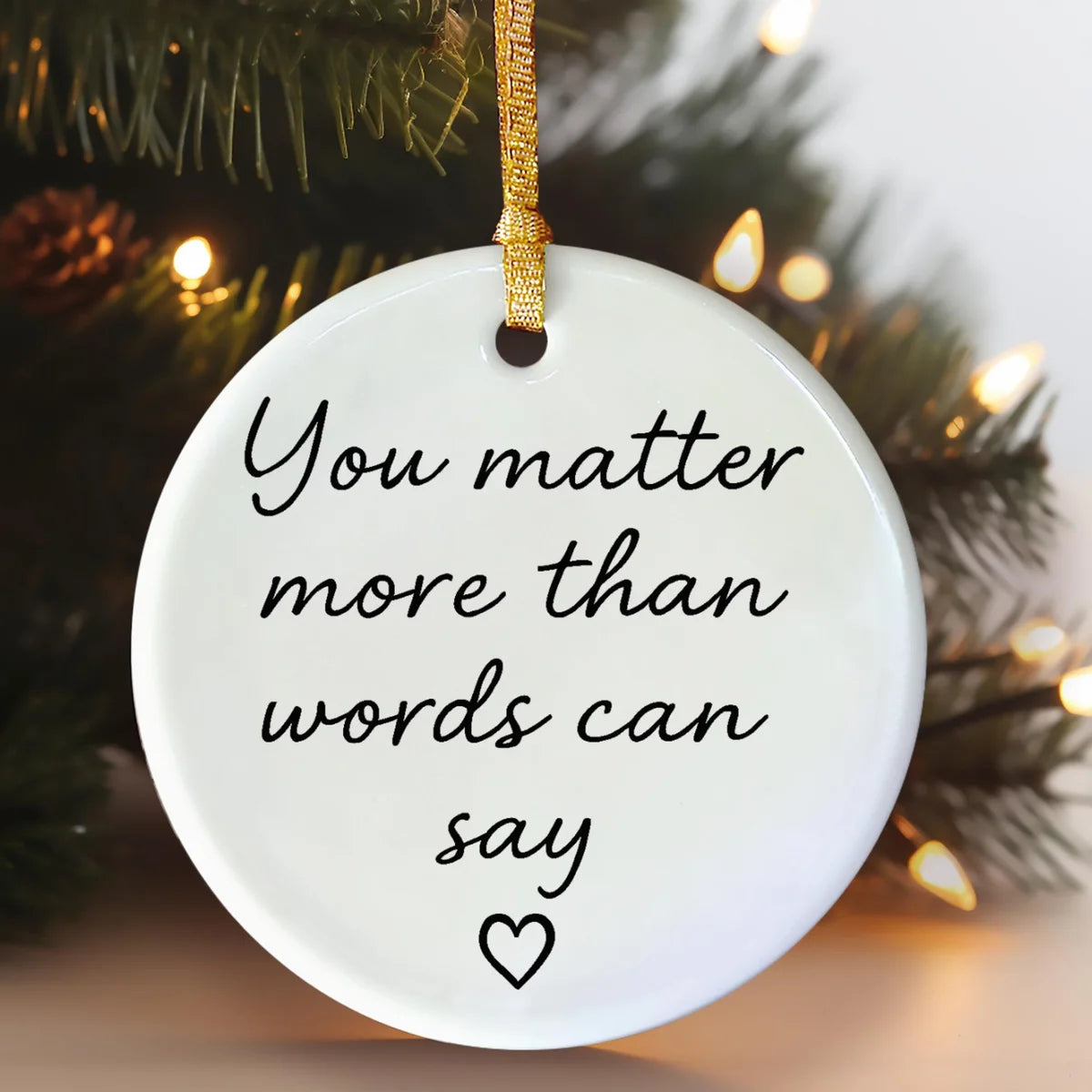 round ceramic ornament with the visible You Matter More Than Words Can Say message.