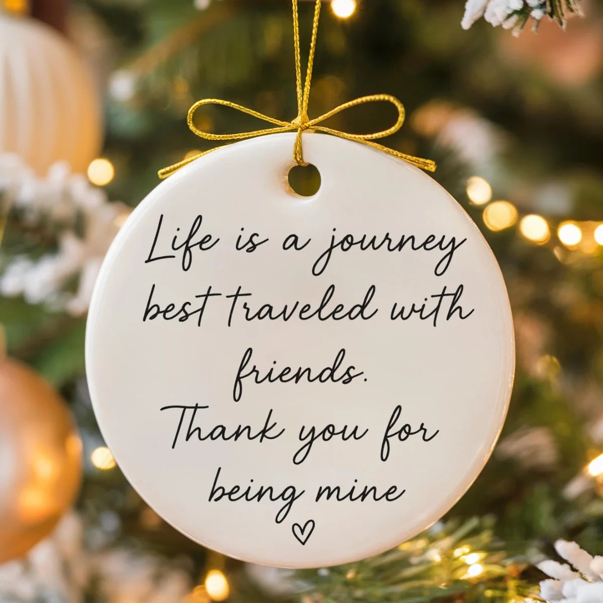 round ceramic ornament with the visible Life Is a Journey Best Traveled With Friends message.