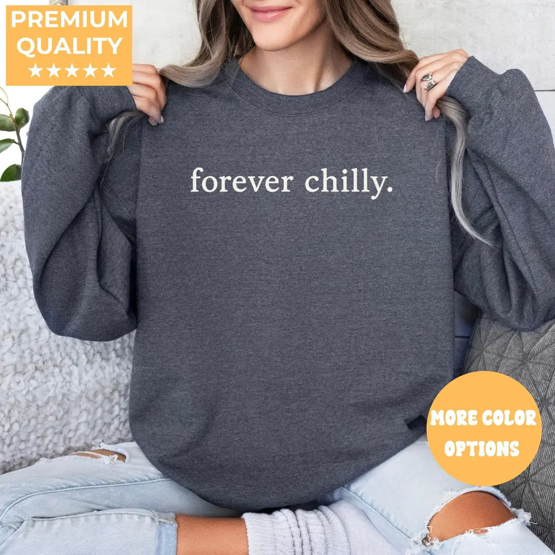 Dark Heather crewneck sweatshirt with Forever Chilly printed design.