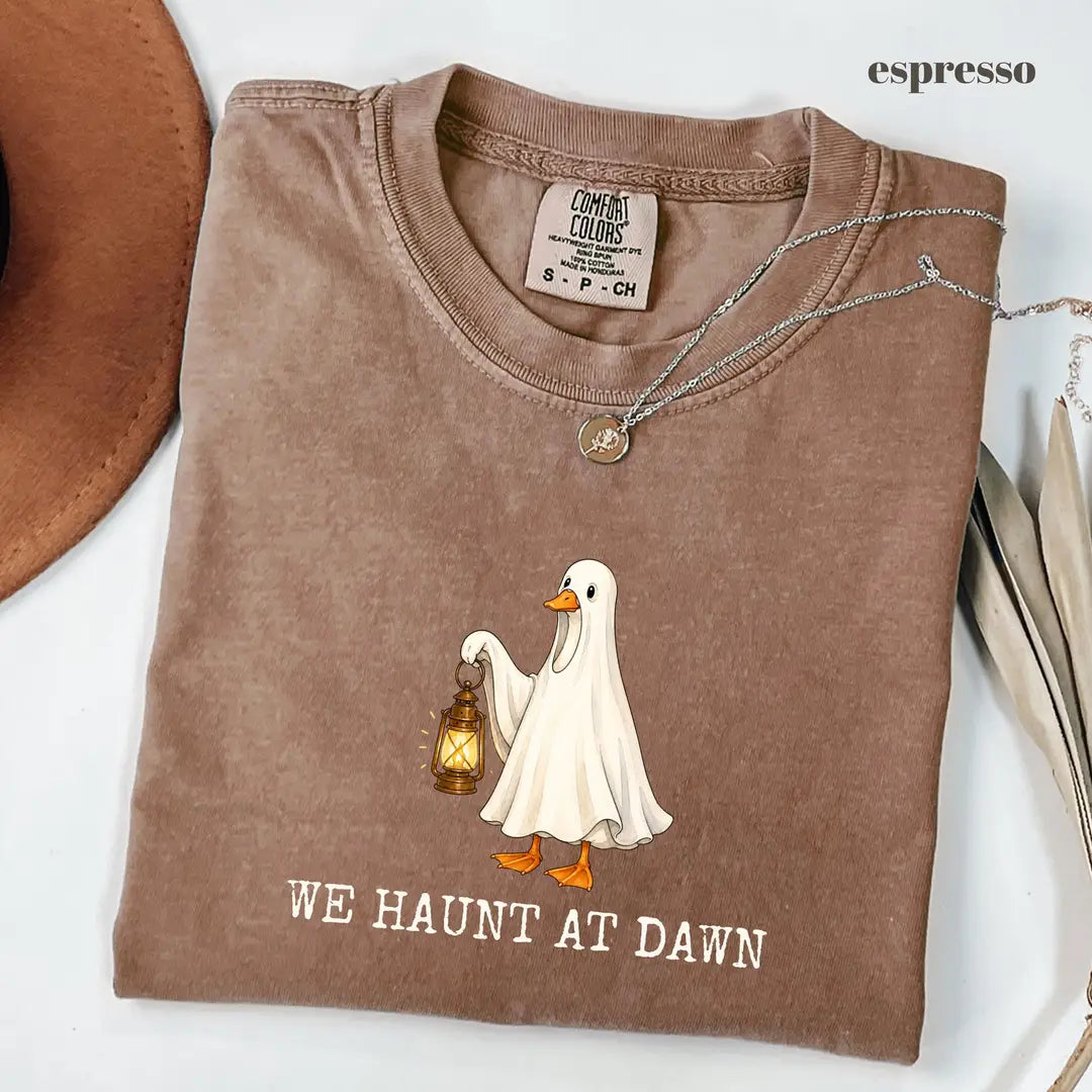 Espresso Comfort Colors 1717 T-shirt with We Haunt At Dawn Goose design worn by a model